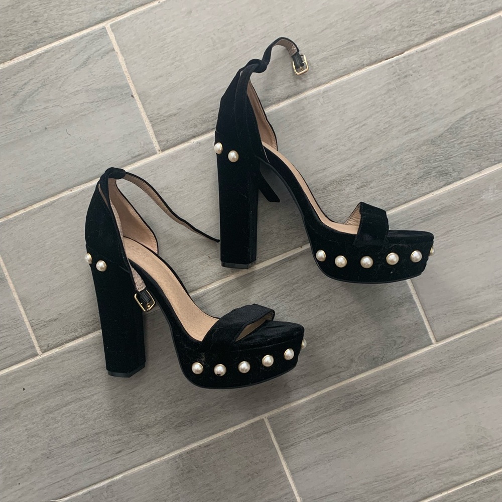 Pair of black and pearl velvet heels